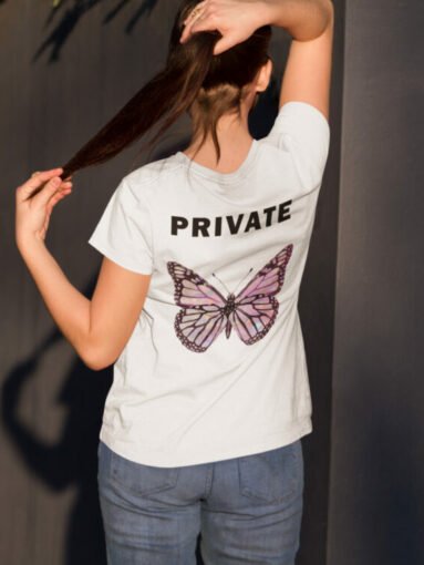 t-shirt-mockup-featuring-a-girl-from-the-back-in-a-courtyard-a9173